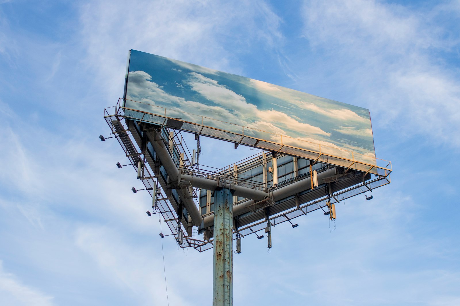 A billboard structure displaying content, used to illustrate the shift to digital out-of-home advertising