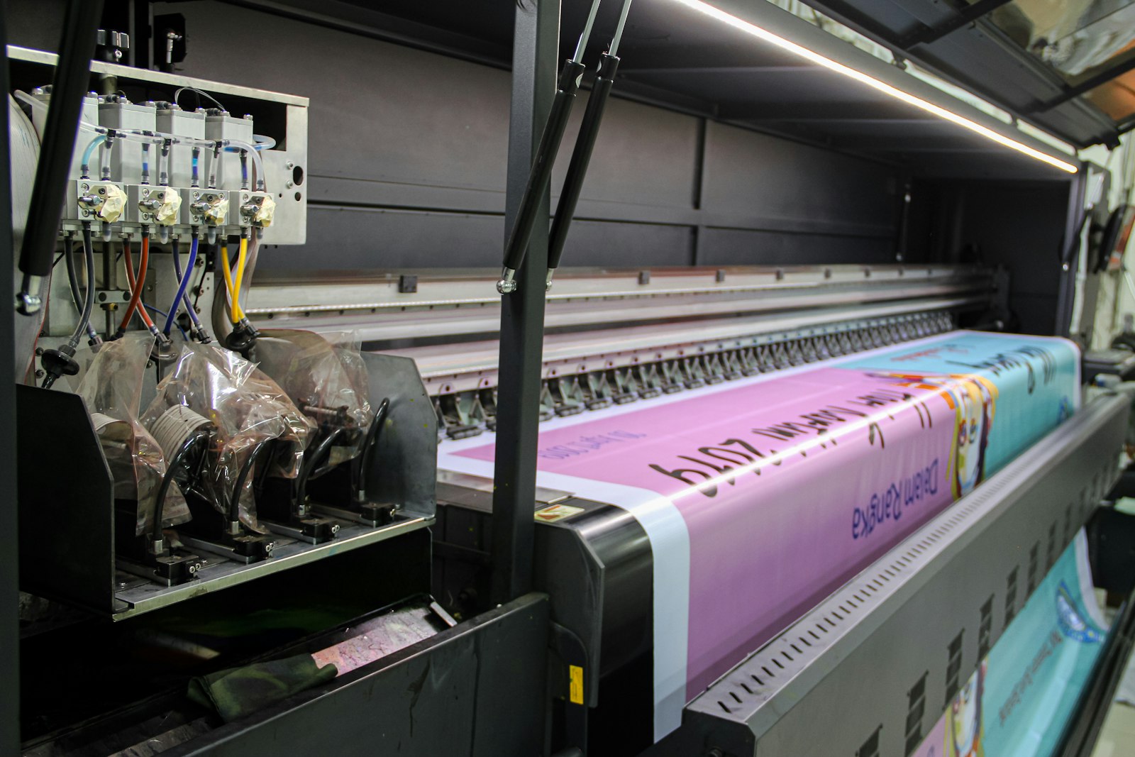 Wide-format printer producing an outdoor-grade vinyl print
